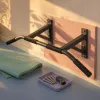 Choisir une barre de traction murale performante pour structurer sa musculation à domicile